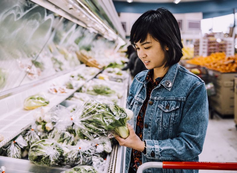 Woman shops for produce at Asian grocery store Hong Phat.