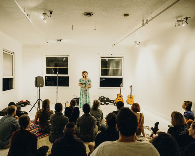 Woman speaking in front of audience at Future Prairie Collective