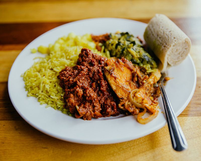 A plate full of food served by Horn of Africa restaurant.