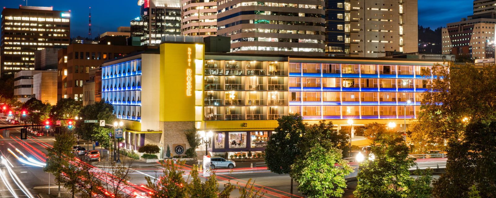 Exterior of the Hotel Rose lit up at night