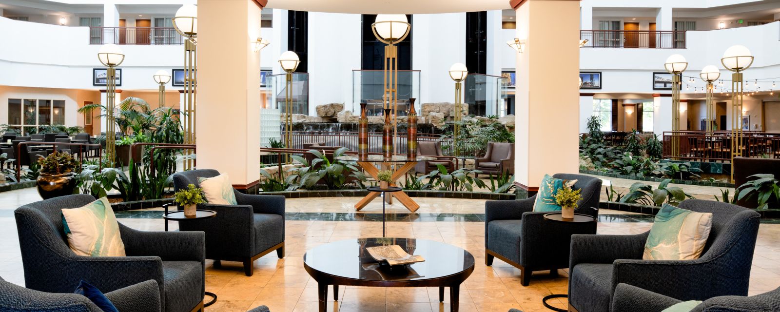 The classy and modern lobby at the Embassy Suites by Hilton Portland Airport, looking out to the atrium.