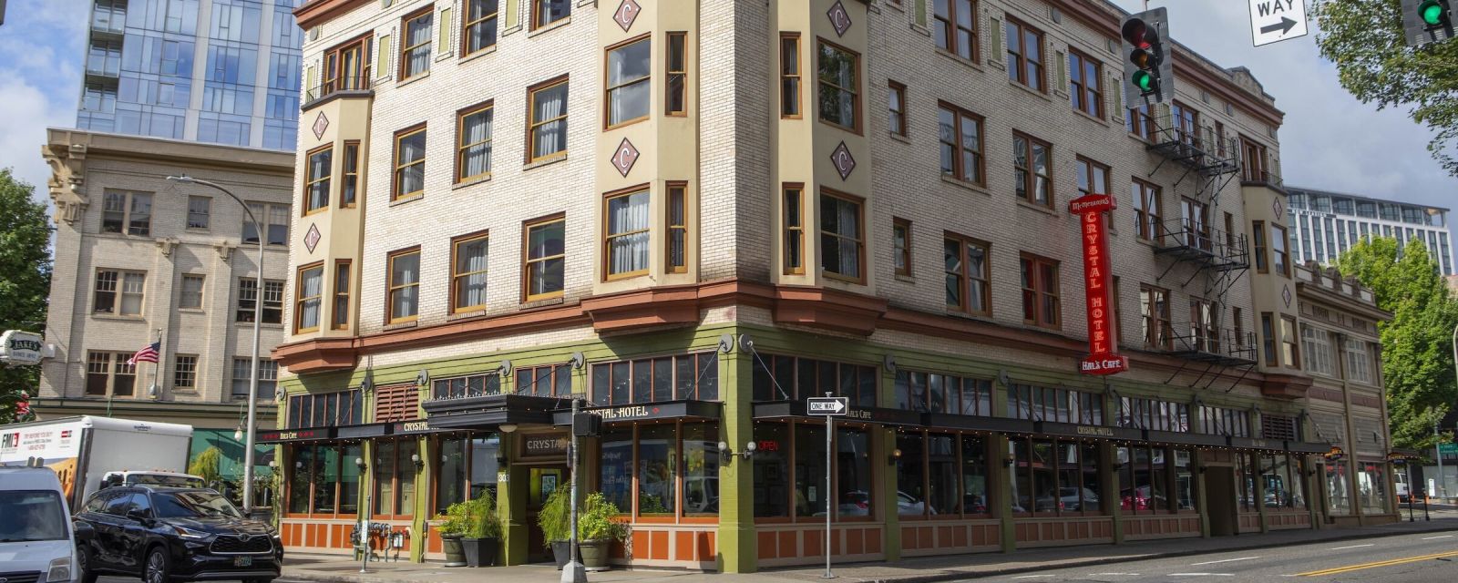 The sunlit exterior of Hal's Café at McMenamins Crystal Hotel