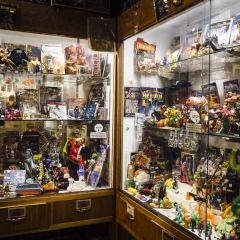Vintage toys on display behind glass at Billy Galaxy