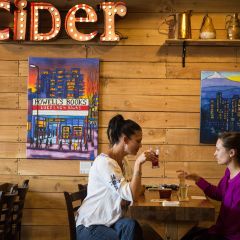 two women drinking cider at Portland Cider House