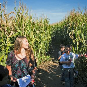 A woman and three children find their way through the tall corn at the Corn Maize at The Pumpkin Patch on Sauvie Island.