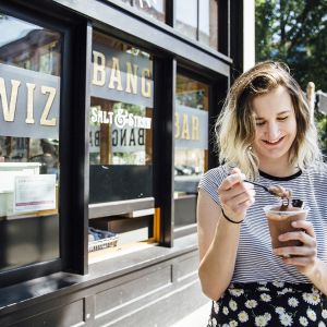 a woman enjoying soft serve ice cream