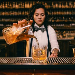 bartender pours a drink