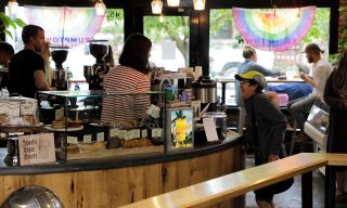 person buying coffee at a coffeeshop