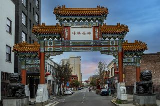 chinese-style gateway frames a city street