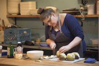a chef chopping ingredients in a kitchen