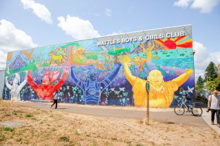 colorful mural in Lents neighborhood depicting multicultural population