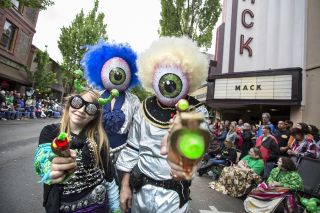 people dressed as aliens at a parade