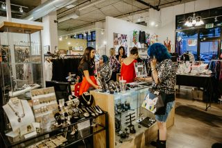 women shopping in a boutique stocked with jewelry and clothing