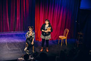 Two female comedians on stage at All Jane Comedy Festival
