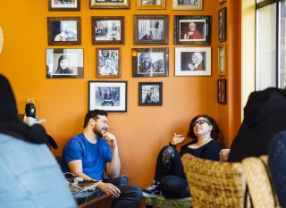 Customers lounge inside Revolución Coffee House.