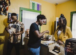 Crews and Kennedy lead an aspiring budtender through their legal cannabis training program.