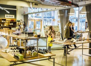 People browsing through hand made items at a store