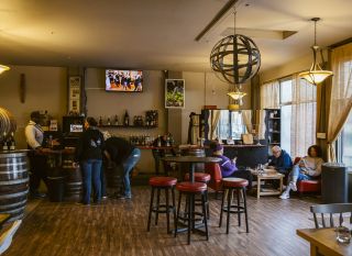 customers casually tasting wine in a tasting room