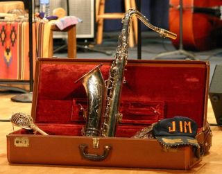 a saxophone in a red velvet-lined case