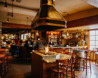 a welcoming fire burning in front of the bar at Amalfi's Restaurant