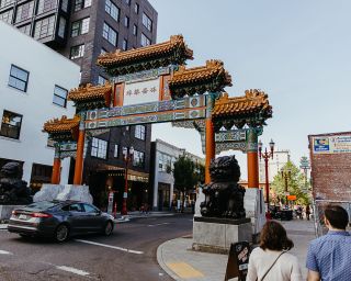 a car drives through Portland's chinatown gates