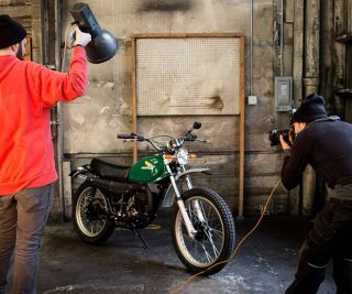a motorcycle with a green fuel tank