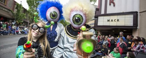 people dressed as aliens at a parade