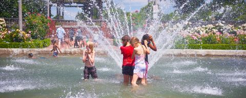 kids splash in the fountain at peninsula park