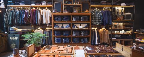 clothing and leather items on display in the Tanner Goods retail shop