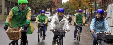 Five cyclists enjoying a bike tour in downtown Portland.