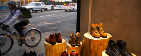 display of boots next to a storefront window