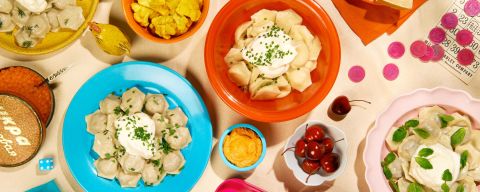 a variety of dumplings on colorful dishware