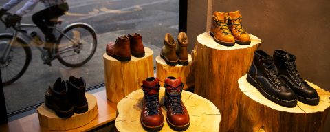 display of boots next to a storefront window