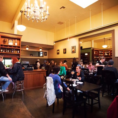 diners sit at tables in a well-lit restaurant