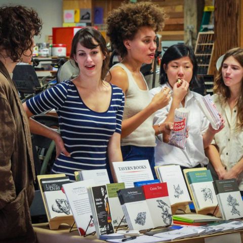 People standing in front of a display of books