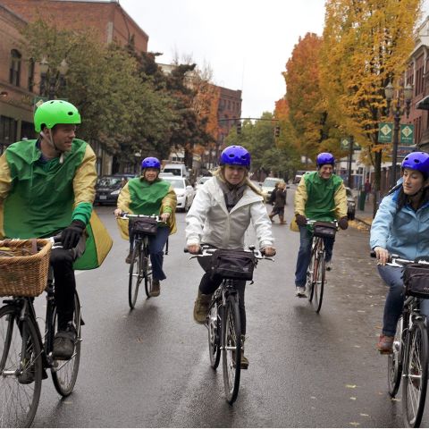 Five cyclists enjoying a bike tour in downtown Portland.