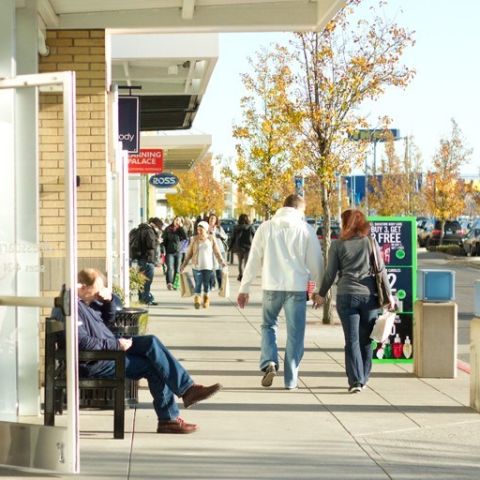 people sitting and strolling outside Cascade Station