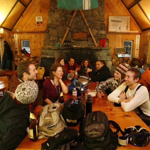 people gathered around Skibowl warmng hut