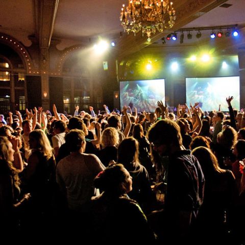 a crowd dancing at a nightclub