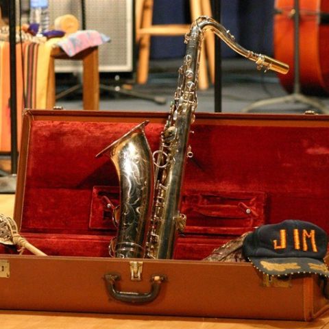 a saxophone in a red velvet-lined case