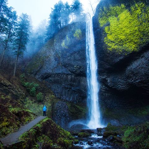 person standing at the base of Latourell Falls