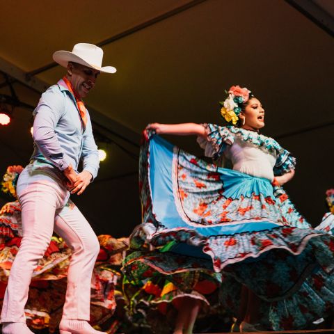 two people dancing on stage