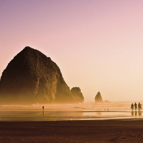sunset view of the ocean and iconic haystack rock