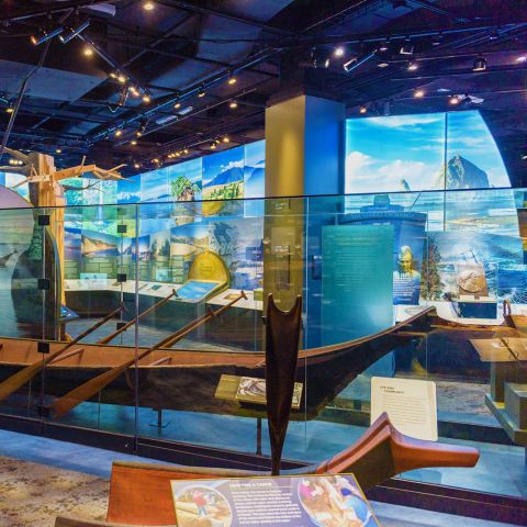 a museum exhibit featuring a wooden canoe