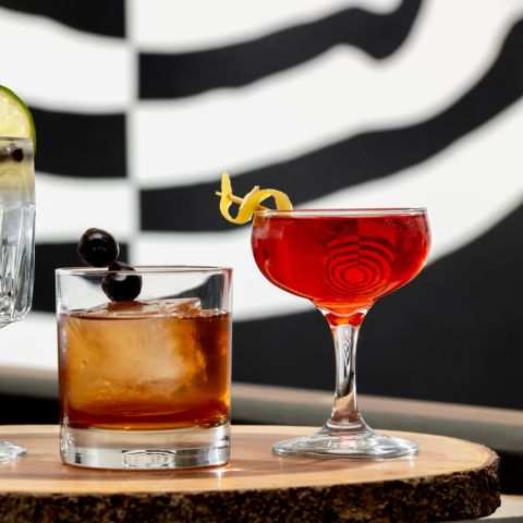 a tray of craft cocktails from High Horse Restaurant in the Bidwell Marriot Hotel