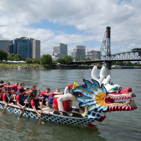 dragon boat with rowers in Wilamette River