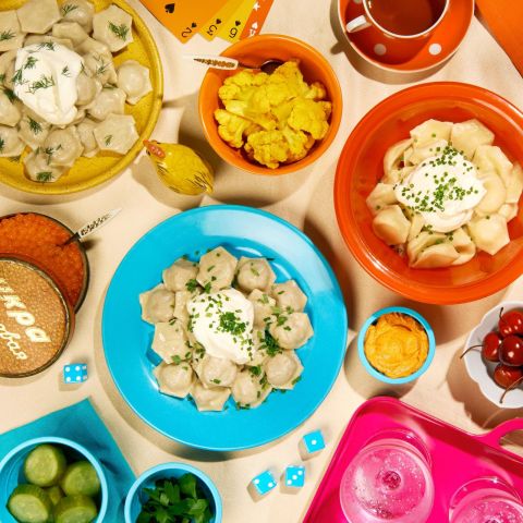 a variety of dumplings on colorful dishware
