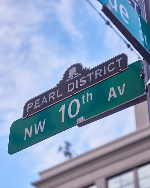 a street sign in the Pearl District showing NW 10th Avenue