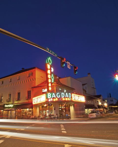 The Bagdad Theater’s neon sign lights up the night on Hawthorne Boulevard.