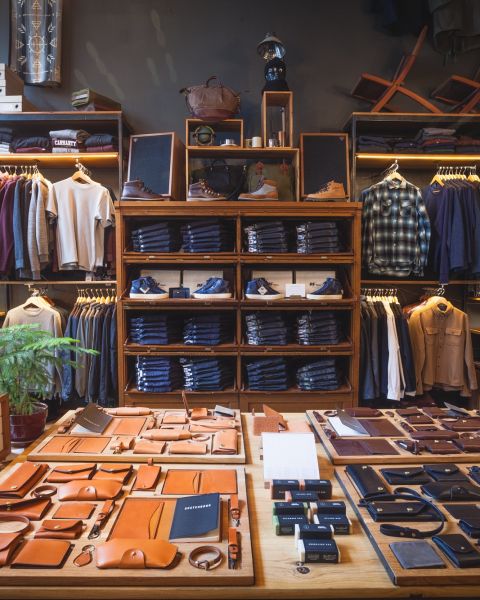 clothing and leather items on display in the Tanner Goods retail shop